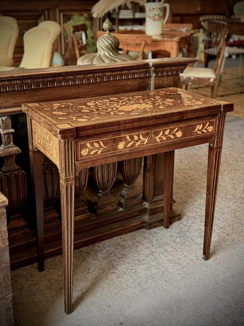 Neoclassical games table, a full hand of elegance